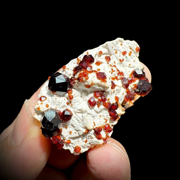 Wine-red garnet crystals on cream feldspar from Yunxiao, Fujian, China, second angle