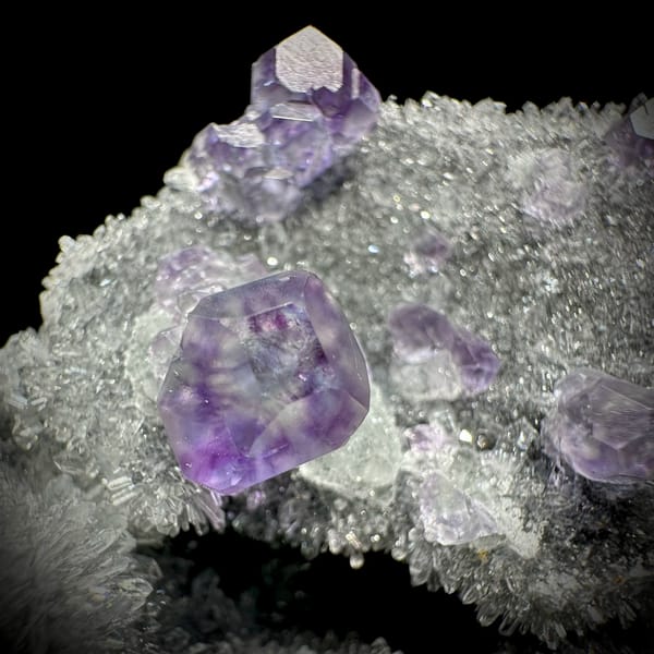 Purple fluorite octahedra on grey quartz mound from Fujian, China, second angle