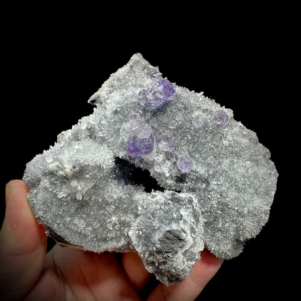 Purple fluorite octahedra on grey quartz mound from Fujian, China, top view
