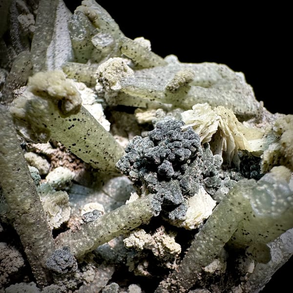 Green chlorite-coated quartz prisms with calcite and goethite from Inner Mongolia, China, second angle