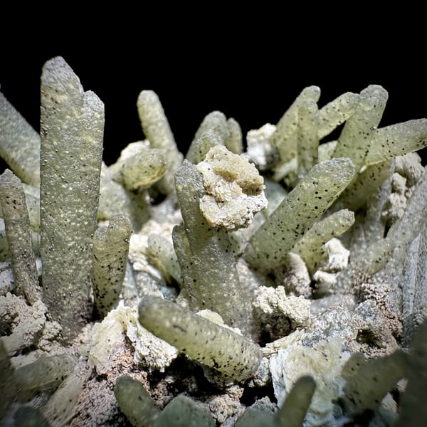 Green chlorite-coated quartz prisms with calcite and goethite from Inner Mongolia, China, reverse side