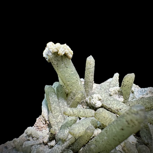 Green chlorite-coated quartz prisms with calcite and goethite from Inner Mongolia, China, top view