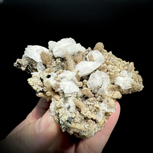 Pale yellow quartz floater with calcite, chalcopyrite and marmatite from Inner Mongolia, China, detail of the matrix contact
