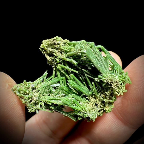 Dense thicket of deep green pyromorphite prisms from Guangxi, China, close-up of the crystal faces