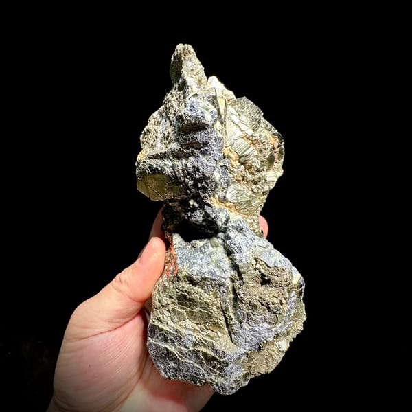 Gourd-shaped block of striated pyrite with galena from Hunan, China, top view