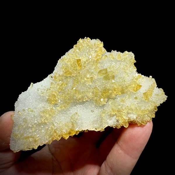 White quartz druse plate with yellow baryte crusts from Jiangxi, China, close-up of the crystal faces