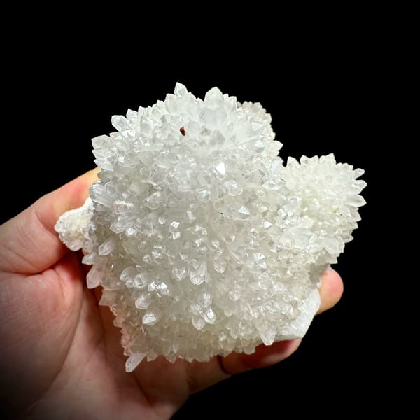 Hollow-shell quartz cluster covered in white points from Fujian, China, second angle