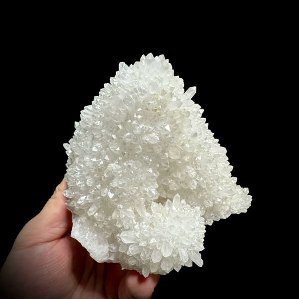 Hollow-shell quartz cluster covered in white points from Fujian, China, reverse side