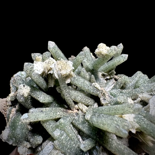 Pale green chlorite quartz prisms with calcite from Inner Mongolia, China, close-up of the crystal faces