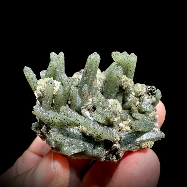 Green chlorite quartz prisms with white calcite from Inner Mongolia, China, close-up of the crystal faces