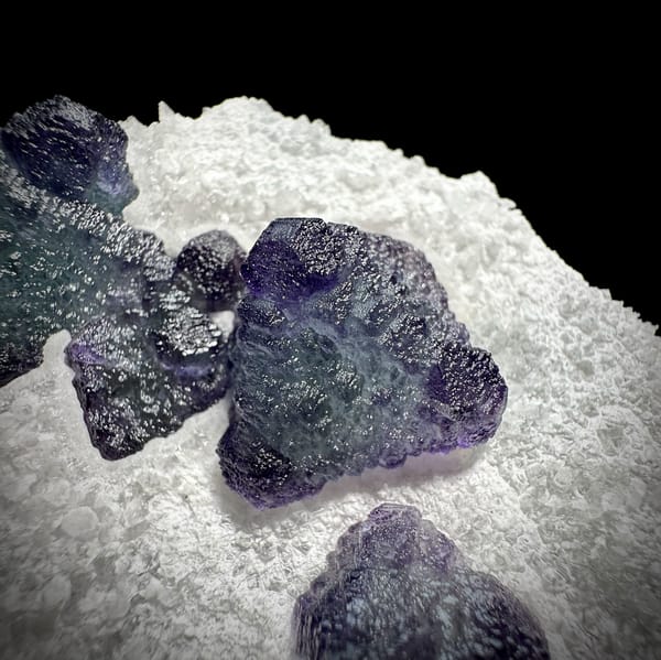Frosted purple fluorite cubes on white sugar-quartz plate from Zhejiang, China, second angle