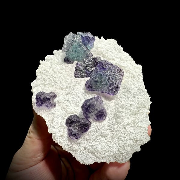 Frosted purple fluorite cubes on white sugar-quartz plate from Zhejiang, China, reverse side