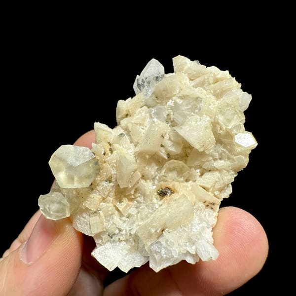 Cream calcite crystals with dolomite, pyrite and quartz from Guizhou, China, close-up of the crystal faces