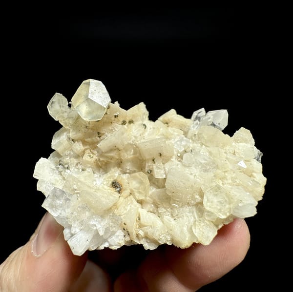 Cream calcite crystals with dolomite, pyrite and quartz from Guizhou, China, detail of the matrix contact