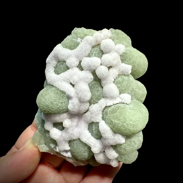Mint-green fluorite balls laced with white fluorite from Henan, China, second angle
