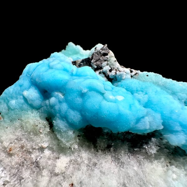 Turquoise botryoidal aragonite over pale green aragonite from Yunnan, China, close-up of the crystal faces