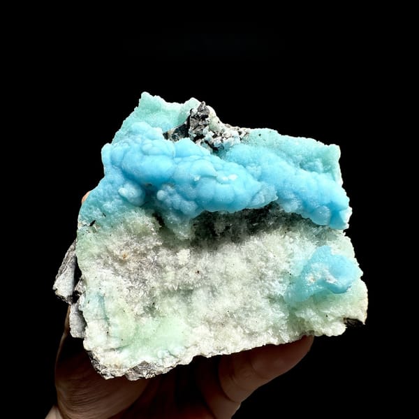 Turquoise botryoidal aragonite over pale green aragonite from Yunnan, China, detail of the matrix contact