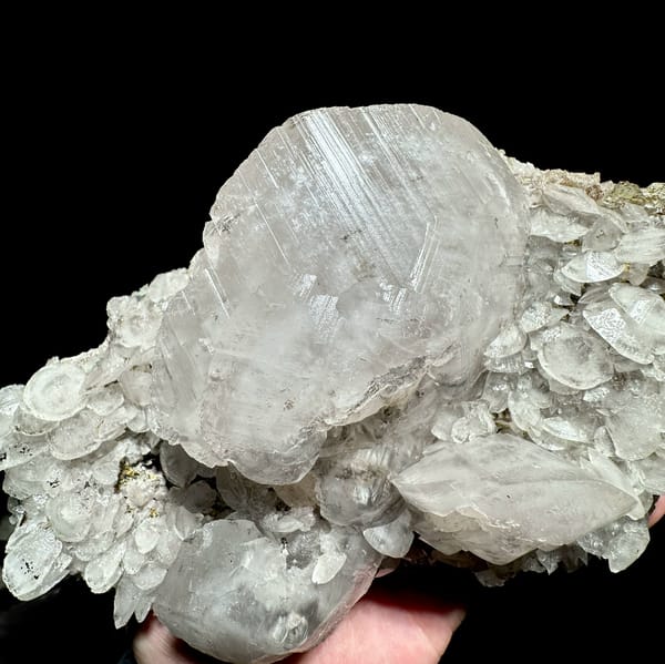 Large frosted calcite crystal over platy calcite and fluorite from Xianghualing, Hunan, China, reverse side