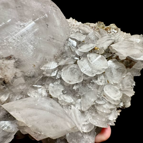 Large frosted calcite crystal over platy calcite and fluorite from Xianghualing, Hunan, China, top view