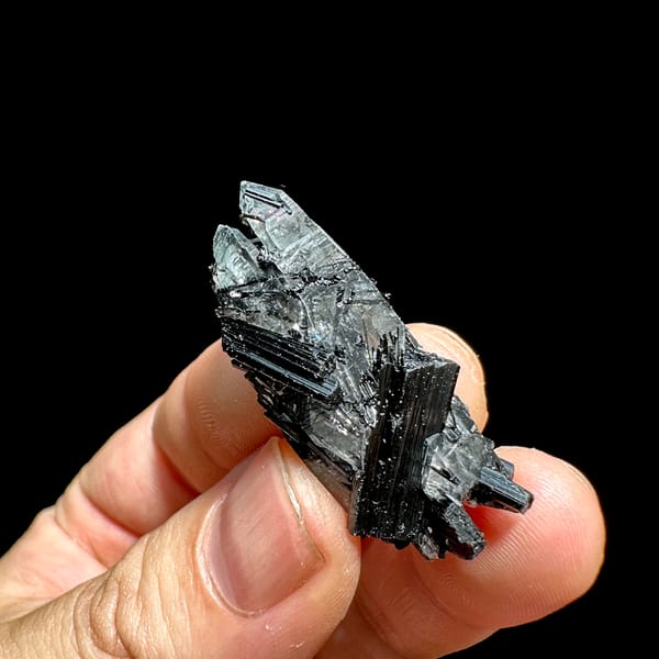 Clear quartz floater enclosing black tourmaline needles from Guangxi, China, top view