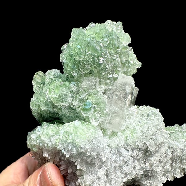 Large frosted calcite crystal on pale green fluorite and quartz from Fujian, China, top view
