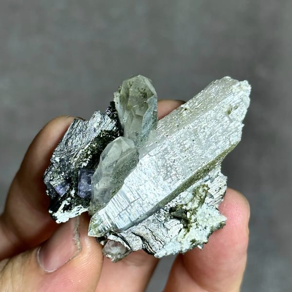Clear quartz prisms with black wolframite and purple fluorite from Yaogangxian Mine, Hunan, China, reverse side
