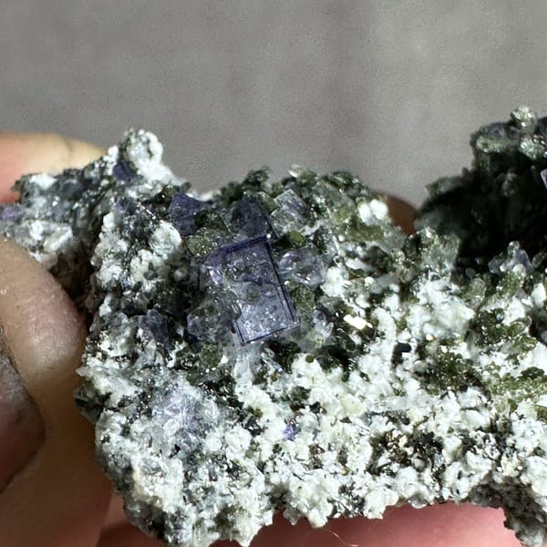 Tall clear quartz prism with purple fluorite and mica from Yaogangxian Mine, Hunan, China, second angle