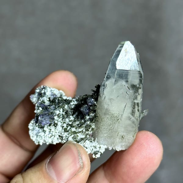 Tall clear quartz prism with purple fluorite and mica from Yaogangxian Mine, Hunan, China, reverse side