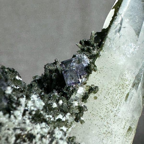 Tall clear quartz prism with purple fluorite and mica from Yaogangxian Mine, Hunan, China, top view