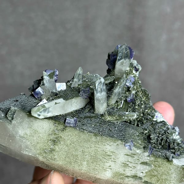 Large chlorite quartz with purple fluorite cubes and wolframite from Yaogangxian Mine, Hunan, China, reverse side