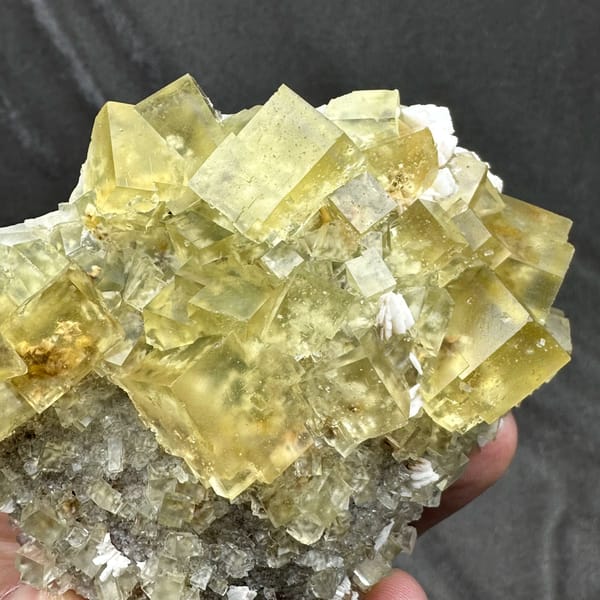 Mound of glassy lemon-yellow fluorite cubes with baryte from Beijing, China, second angle