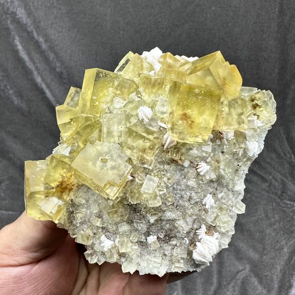 Mound of glassy lemon-yellow fluorite cubes with baryte from Beijing, China, reverse side