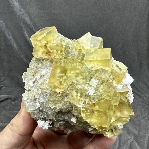 Mound of glassy lemon-yellow fluorite cubes with baryte from Beijing, China, top view
