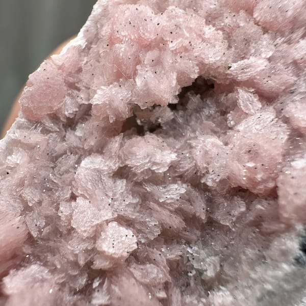 Band of pink rhodochrosite through white quartz needles from Guangxi, China, top view