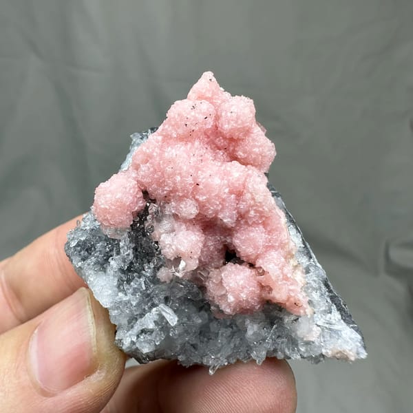 Rose-pink rhodochrosite over grey quartz with pyrite from Guangxi, China, reverse side