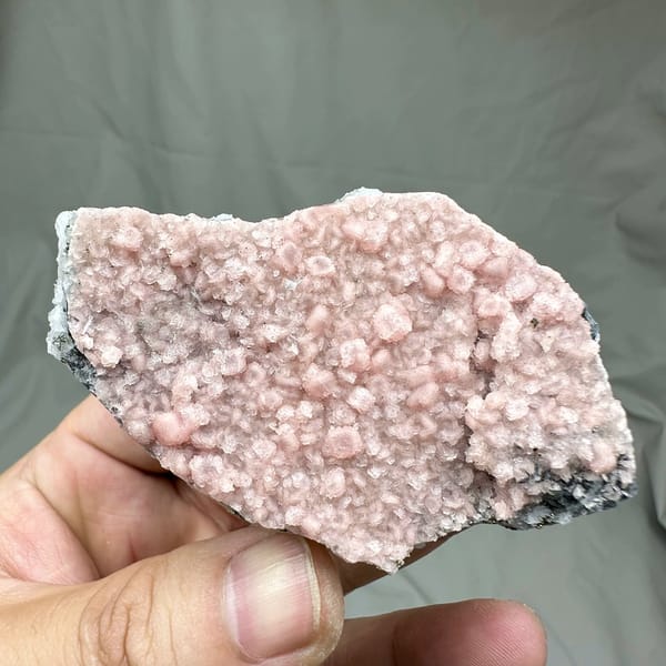 Pink rhodochrosite flecks in frosted white quartz cluster from Guangxi, China, reverse side