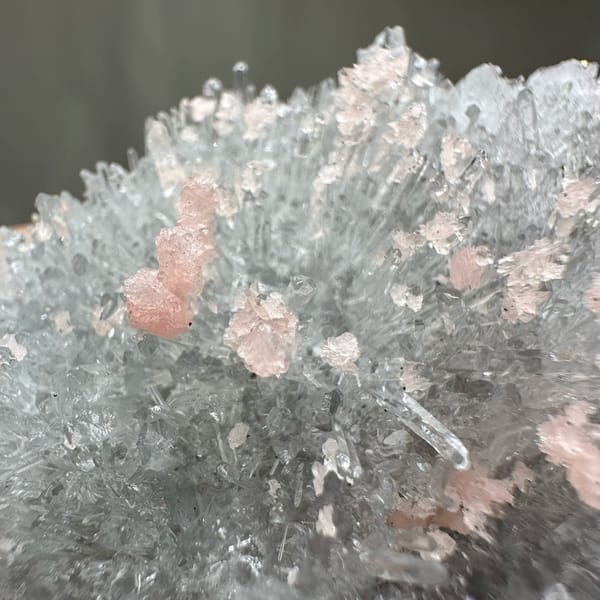 Pink rhodochrosite flecks in frosted white quartz cluster from Guangxi, China, top view