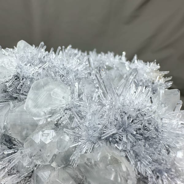 Frosted quartz needles around pale calcite prisms from Fujian, China, reverse side