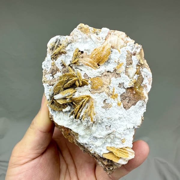 Golden baryte rosettes and white aragonite with mimetite from Morocco, second angle
