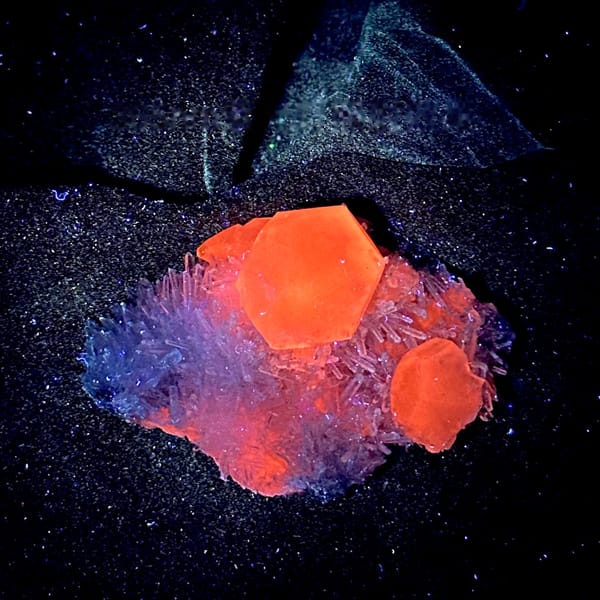 Large translucent calcite crystal in nest of quartz needles from Fujian, China, second angle