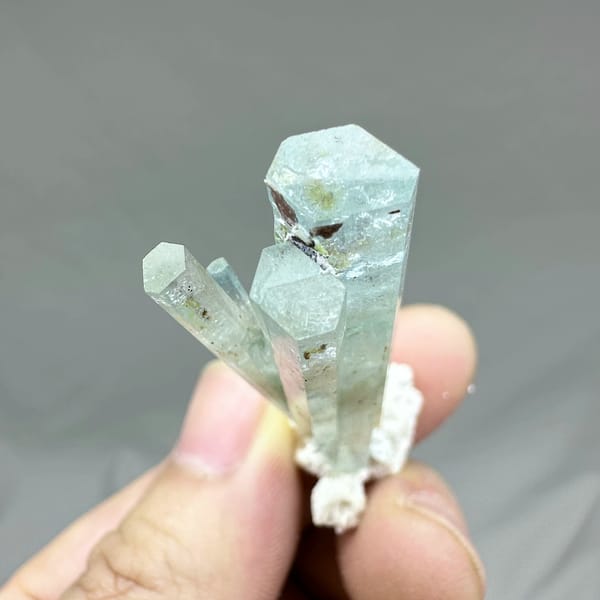 Sea-green aquamarine prism with white feldspar collar from Namibia, second angle