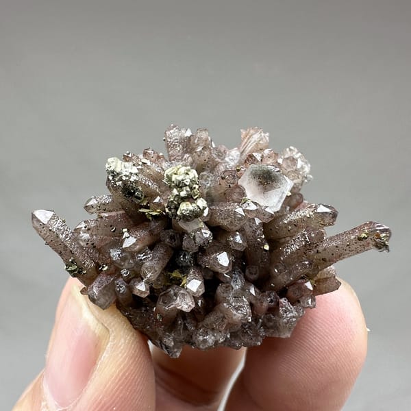 Red-brown hematoid quartz needles with pyrite and calcite from Fujian, China, detail of the matrix contact