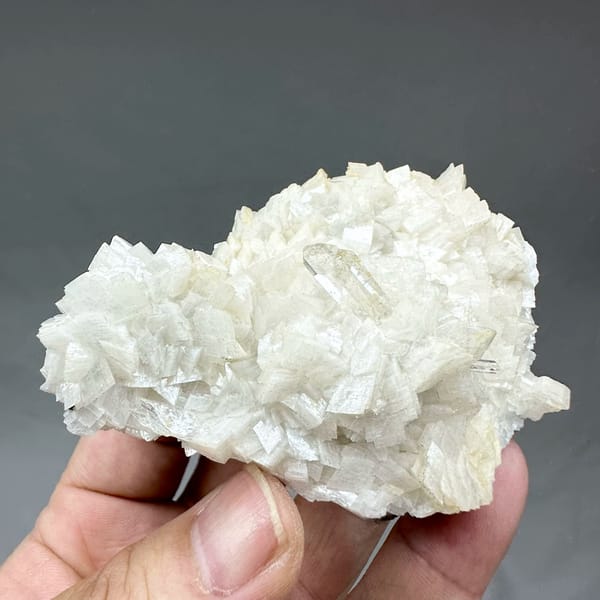 Plate of cream dolomite rhombs with clear quartz from Guizhou, China, top view