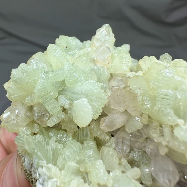 Pale green fan-shaped prehnite with quartz points from Morocco, second angle