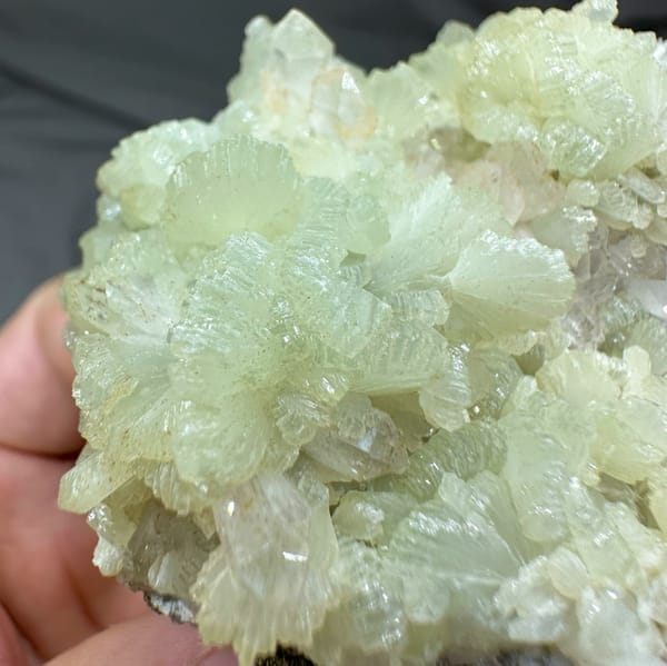 Pale green fan-shaped prehnite with quartz points from Morocco, reverse side