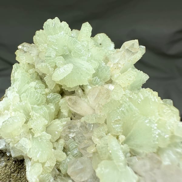 Pale green fan-shaped prehnite with quartz points from Morocco, top view