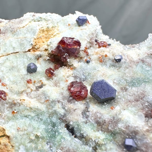 Large plate of red hematoid quartz with sphalerite and galena from Hunan, China, reverse side