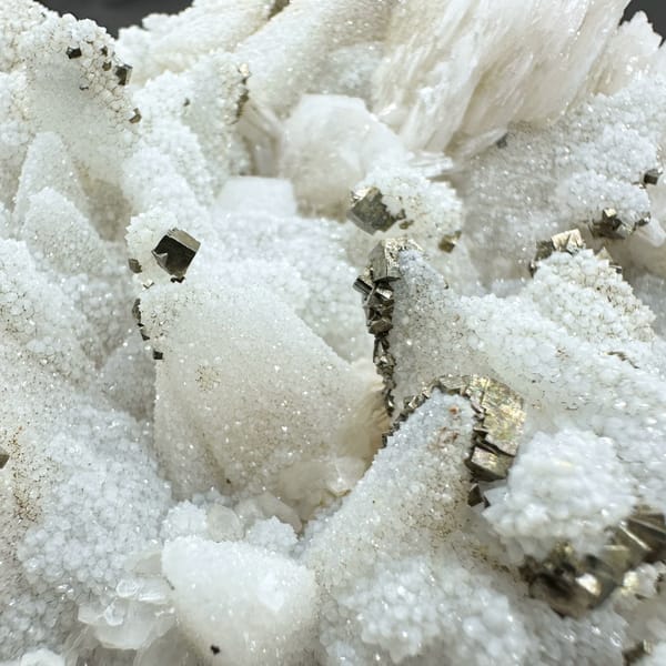 Plate of frosted white calcite crystals with pyrite from Fujian, China, second angle