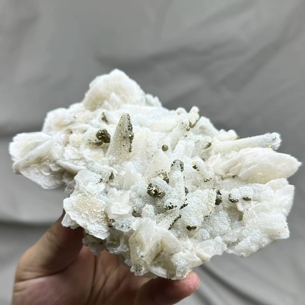 Plate of frosted white calcite crystals with pyrite from Fujian, China, top view