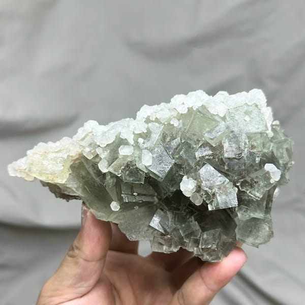 Pale grey-green fluorite cubes with white calcite on plate from Xianghualing, Hunan, China